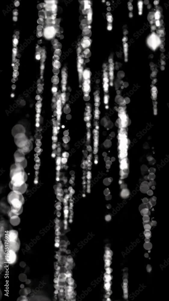 Luminous abstract white particles gently falling downwards against an absolute void of pure black, with a subtle slow downward camera tilt and soft bokeh effect, creating a calm atmospheric Luminous abstract white particles gently falling downwards against an absolute void of pure black, with a subtle slow downward camera tilt and soft bokeh effect, creating a calm atmospheric