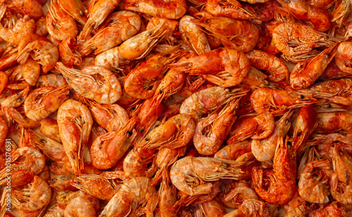 Shrimp close-up in a large pile. Smoked and salted shrimp with spices for a beer snack.