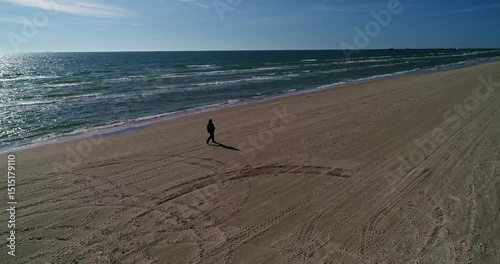 Taking a Quiet and Solitary Stroll on a Beautifully Serene Beach During Sunset Time