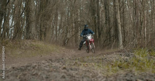 Experience the thrilling offroad motorcycle ride through the dense and beautiful woods