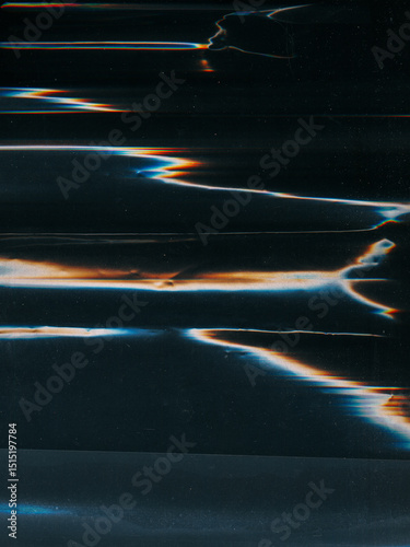 Shattered screen. Dust scratch overlay. Blue orange white color flare matrix glitch cracked distressed texture on dark black abstract background.