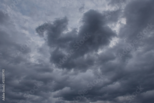 Fototapeta Naklejka Na Ścianę i Meble -  Central Kazakhstan. View of the gloomy dramatic sunset sky with dark clouds.
