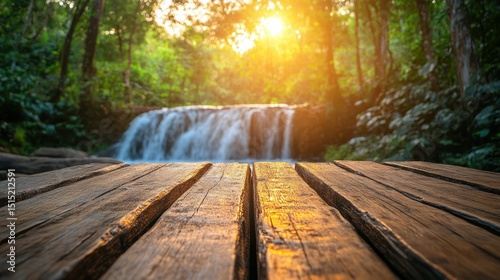 Wooden platform in front of a waterfall at sunset. Lush forest surrounds