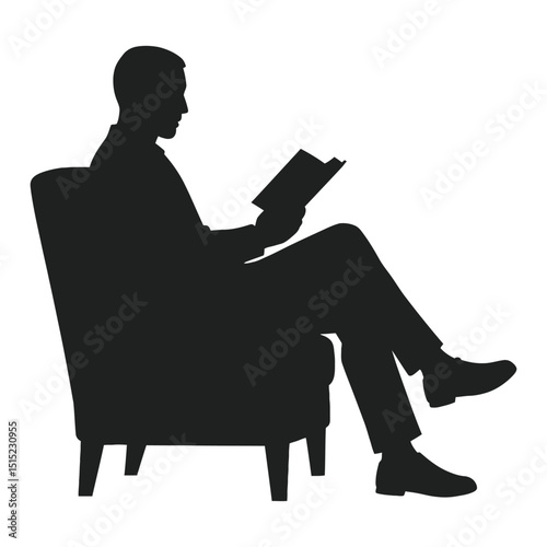 Silhouette of a man relaxing and reading a book in a comfortable armchair
