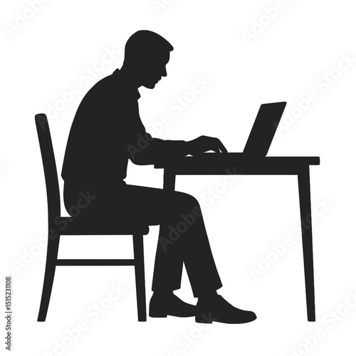 Silhouette of a man working on a laptop computer at a desk