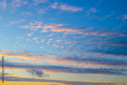 Fototapeta Naklejka Na Ścianę i Meble -  Blue evening sky with illuminated clouds at sunset. Celestial landscape