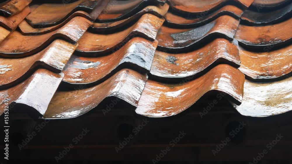 raindrops falling on the roof tiles of the house