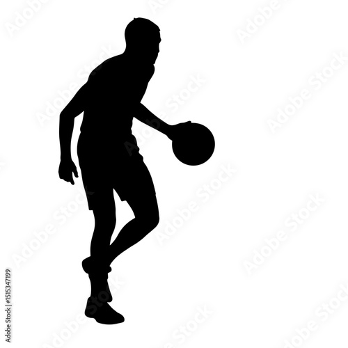 Silhouette of a male basketball player dribbling a ball during play  