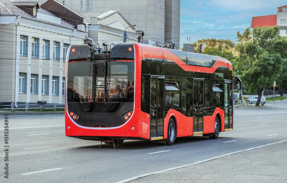 Fototapeta premium electric bus moves along the street