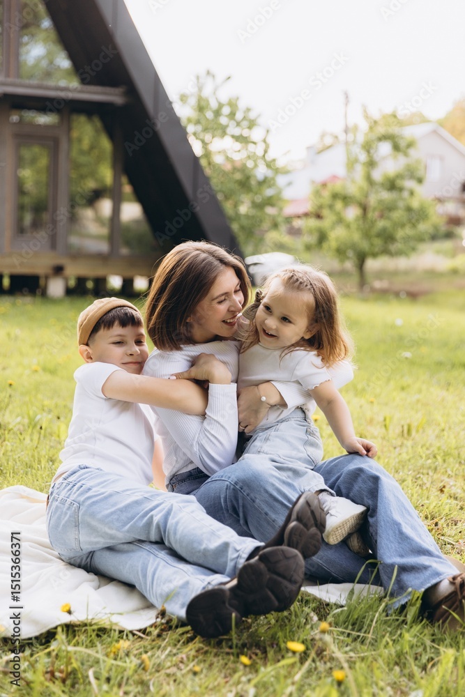 Fototapeta premium Happy family enjoying leisure time in their backyard