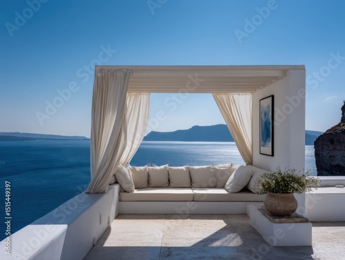 A white gazebo with a blue and white painting on the wall. The gazebo is overlooking the ocean