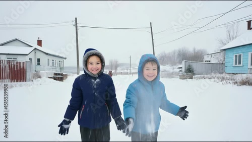Smiling caucasian children in winter jackets standing outside in snowy village