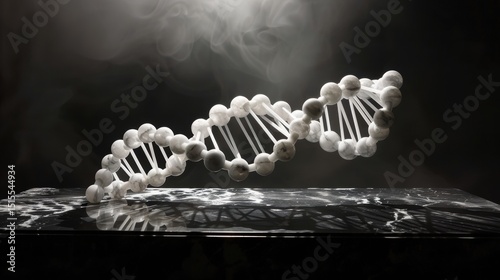 Intricate DNA art crafted from white onyx and carrara marble beads displayed on polished ebony surface under dramatic lighting