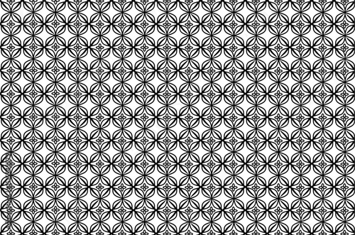 Elegant Kawung Batik pattern design with leaf elements in white and brown on a brown background. This symmetrical pattern exudes a classic and decorative feel, perfect for fabric, wallpaper or others.