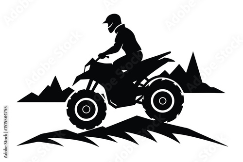 Silhouette of an atv rider navigating rugged terrain with mountain peaks in the background.