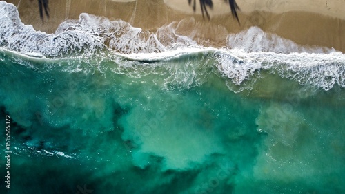 Aerial View of Ocean Waves Crashing on Sandy Beach