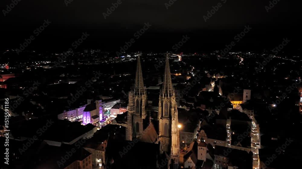 Regensburg Cathedral, or St. Peters Cathedral most important church and landmark of Regensburg, Germany. Aerial night view highlights stunning architecture of this iconic structure. Regensburger Dom. 