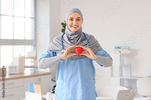Female Muslim doctor in hij...