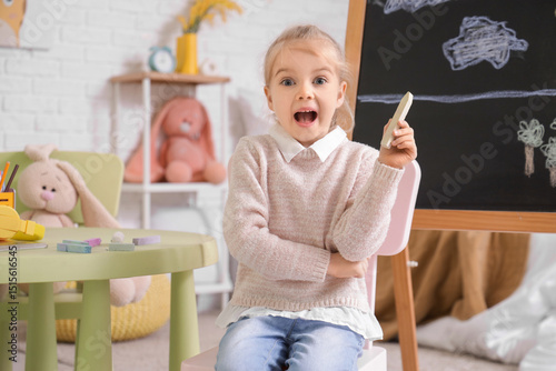 Shocked little girl with ch...