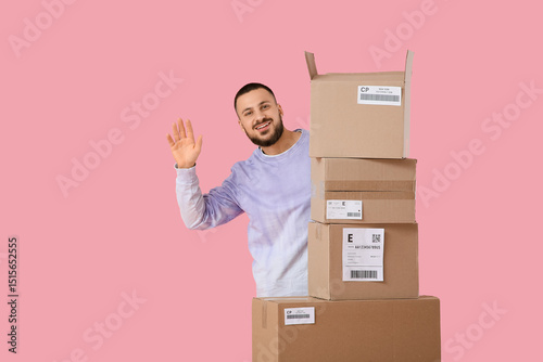 Young man with parcel boxes...