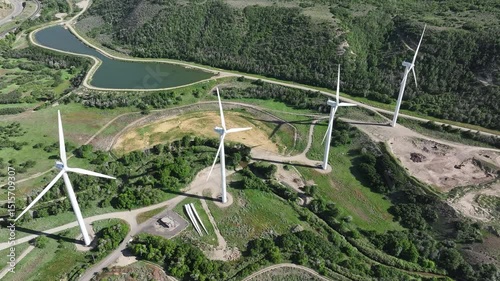 Aerial Spanish Fork Utah mountain windmill slide 1. Project completed 2008. 9 turbine wind energy produce 18.9 megawatts can power 6,000 typical homes. Environmental clean energy. 