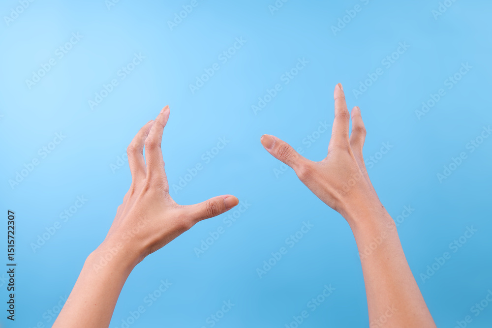 Gesture Of Both Hands With Something Over Blue Background Gesture Of Both Hands With Something Over Blue Background