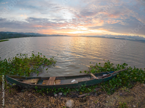 Boat on Lake at Sunset photo