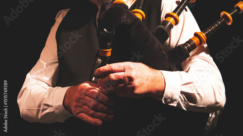 Tableau sur toile Man playing bagpipes scottish outfit clothing hands close up