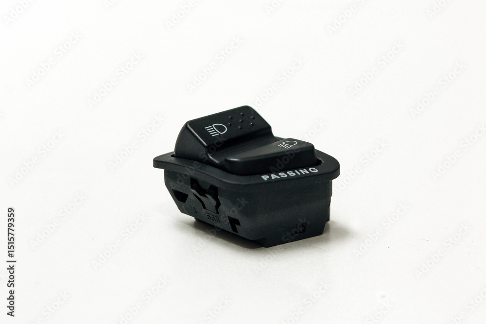 Headlight switch button for motorcycle, for high and low beam, isolated on white background Headlight switch button for motorcycle, for high and low beam, isolated on white background