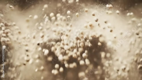 Dynamic Explosion of Small Round Particles Scattering Upwards in a Dusty Brown Haze with Bokeh Effect