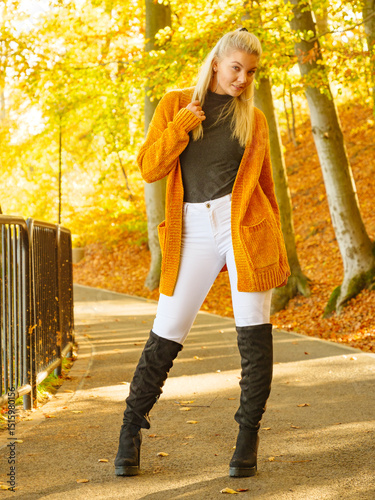 Woman walking in autumn park