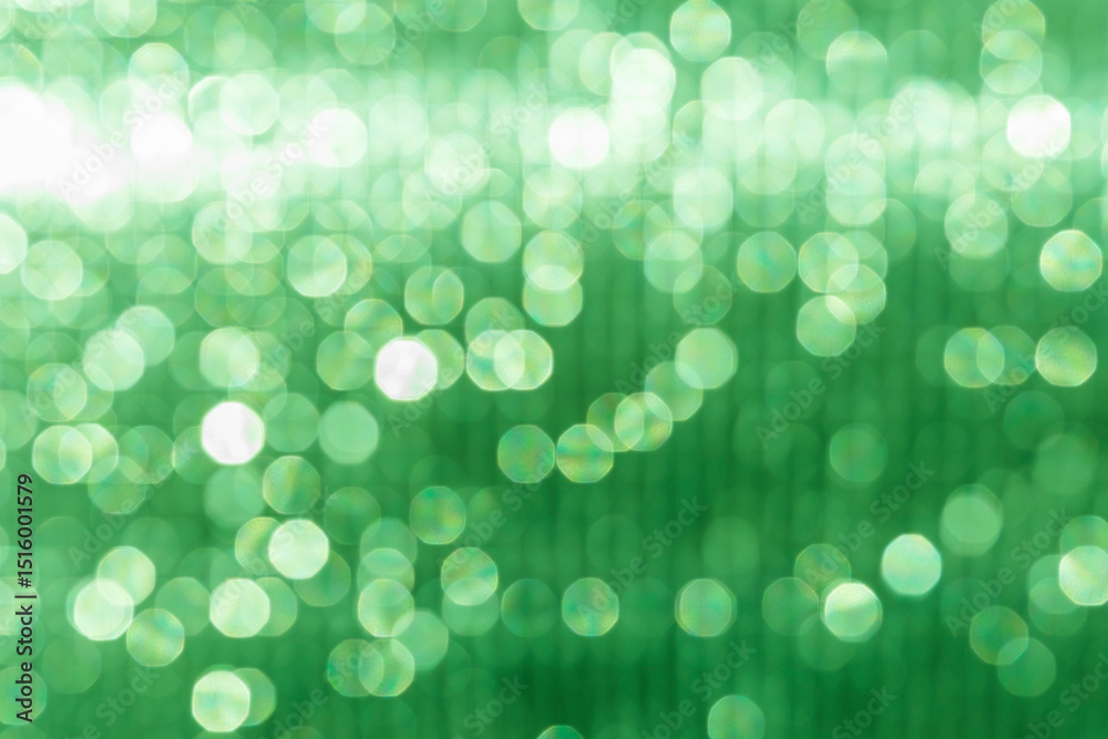 Abstract blurred green light bokeh background, festive season concept background, green bokeh pattern background Abstract blurred green light bokeh background, festive season concept background, green bokeh pattern background