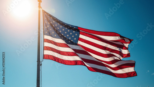 Vibrant, high-resolution stock photo of a majestic U.S.A. flag waving against a clear blue sky, perfect for patriotic advertising and promotions. photo