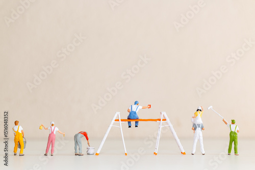 Miniature Painters at Work on Blank Wall