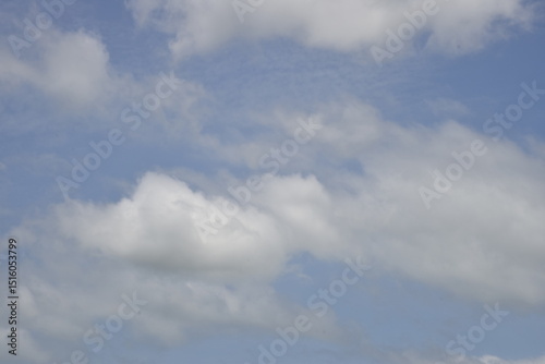 Fototapeta Naklejka Na Ścianę i Meble -  Peaceful blue sky with floating clouds	