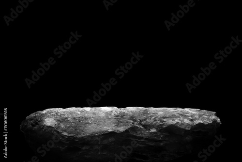Stone podium on dark black background..