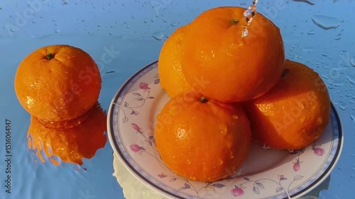 Orange with splash, drip and whirlpool. Makes a refreshing impression. Horizontal Video.