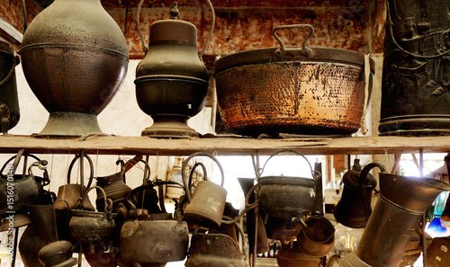 Vintage and old kitchenware on wooden shelf