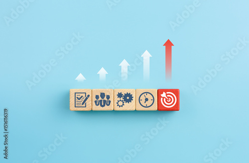 Arrow up and wooden cubes with business strategy icons on blue background