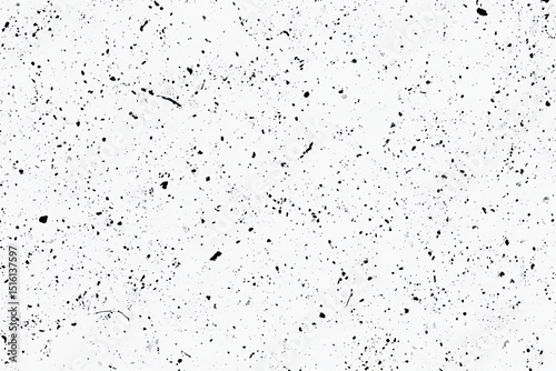 Abstract textured surface with scattered dark speckles.  A variety of marks and dots create a unique pattern on a white background
