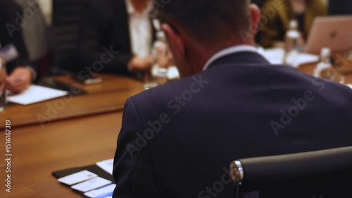 Diplomatic delegation meeting negotiation, group of men in business suits talking and discussing at conference, politicians debate and negotiate, businessmen have dialog, conversation on forum summit
