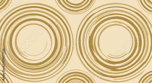 Abstract gold circular pattern on a light beige background  