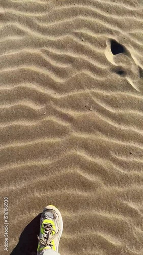 footprints and walk in sand, vertical video, summer beach landscape 