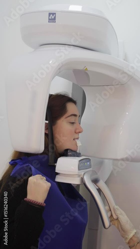Patient undergoing dental cone beam computed tomography