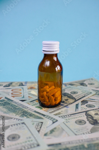 brown glass bottle for supplement product isolated on blue background with clipping path