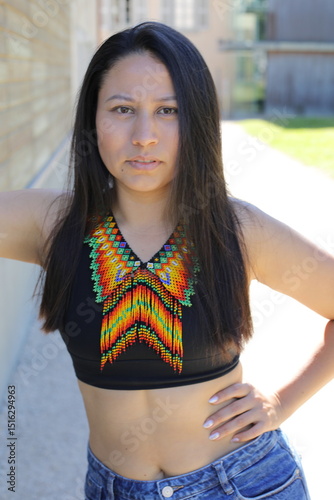 Native American woman with traditional colorful outfit 