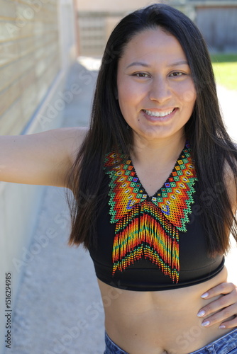 Native American woman with traditional colorful outfit 