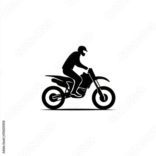 Silhouette of a male rider on a motorcycle in action.