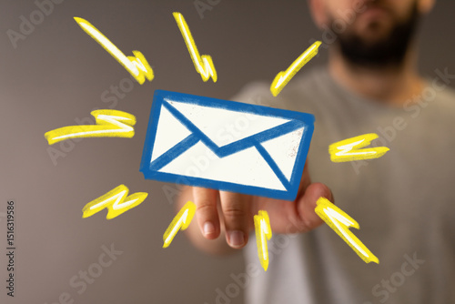 Hand holding digital email ...