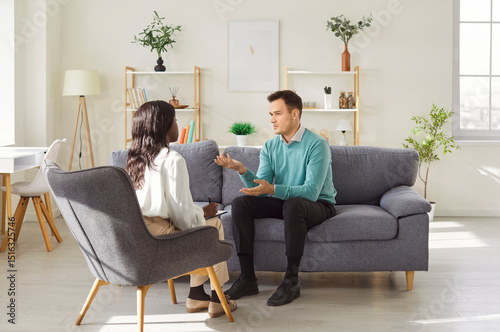 Tableau sur toile African American woman talking with man, answering hr manager employer questions